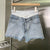 Early spring new product fake two-piece design elastic double waist letter ribbon stitching raw edge all-match denim shorts