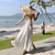 2022 Spring Summer Sexy Backless Waist Bow French Long White Suspender Dress V Neck Beach Style Satin Dress Vacation Style Dress
